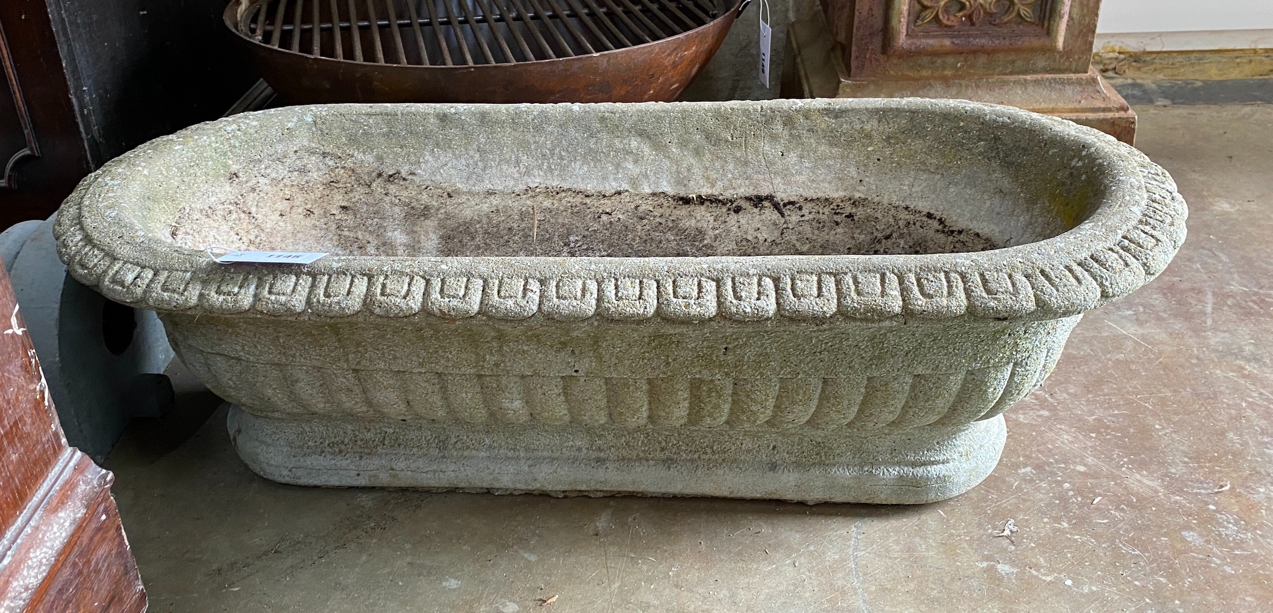 A reconstituted stone garden planter, width 89cm, depth 38cm, height 28cm